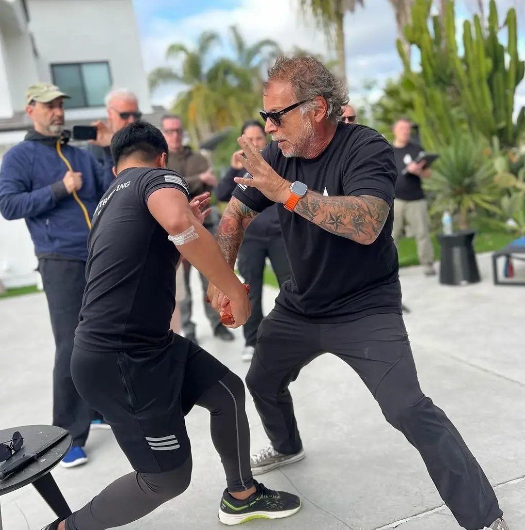 Coach Tony Blauer coaching a student through a SPEAR System drill outdoors